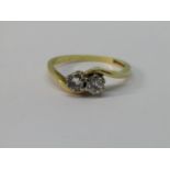 18ct two stone diamond crossover ring, each stone 0.20cts approx, size P, 3.6g
