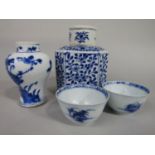 A collection of oriental blue and white ceramics including a 19th century caddy and cover of