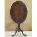 A small Georgian style oval snap top occasional table with pie crust border raised on a turned