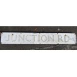 A reclaimed aluminium sign "Junction Road" with painted finish, mounted/screwed onto what appears to