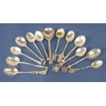 A collection of novelty and interesting souvenir knop spoons to include a bust of King George V,