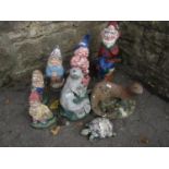 Five small composition stone garden gnomes with brightly painted finish, together with three further