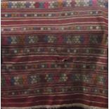 Sumak type Kelim with various banded relief stitch decoration, red ground, 240 x 150cm