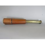 Leather clad and brass military draw telescope by W Watson & Sons Ltd of London, dated 1909