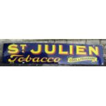 A vintage enamel sign of rectangular form advertsing St Julian tobacco cool and fragrant, bright