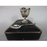 Cased Walker & Hall silver christening egg cup and spoon, the egg cup with cast wavy banded rim,