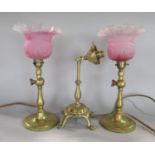 Good pair of brass table lamps with hinged ball socket joints in the stem and opaque glass shades,