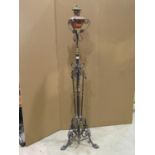 A late Victorian brass and iron work floorstanding telescopic oil lamp standard with decorative