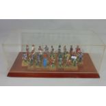 Presentation case displaying 34 individual standing figures of historical soldier figures in