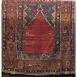Old Persian rug with central medallion decoration and floral borders, washed red ground, 180 x 135cm