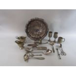 A mixed collection of continental white metal and silver plate comprising a scalloped dish upon