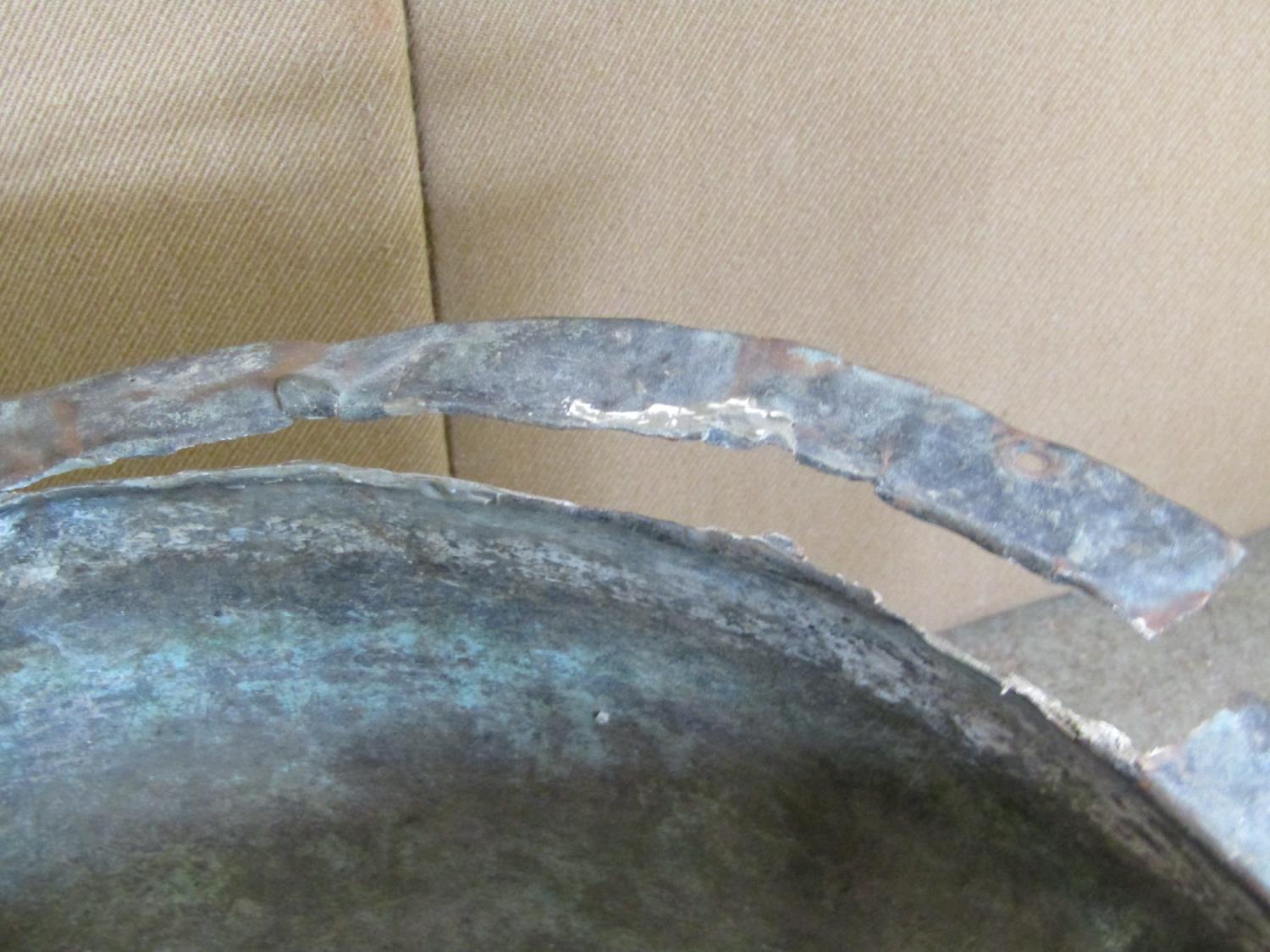 A small weathered copper with flared rim and riveted seams, 45 cm in diameter (drilled base), - Image 4 of 4