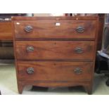 A Regency mahogany and pine sided caddy top bedroom chest of three long graduated drawers with