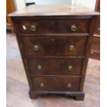 A small walnut veneered chest of four long drawers in the Georgian manner, the drawers with