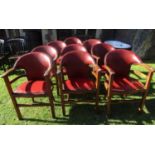 A set of nine arts and crafts/deco style oak framed tub chairs with rexine upholstered pad seats and