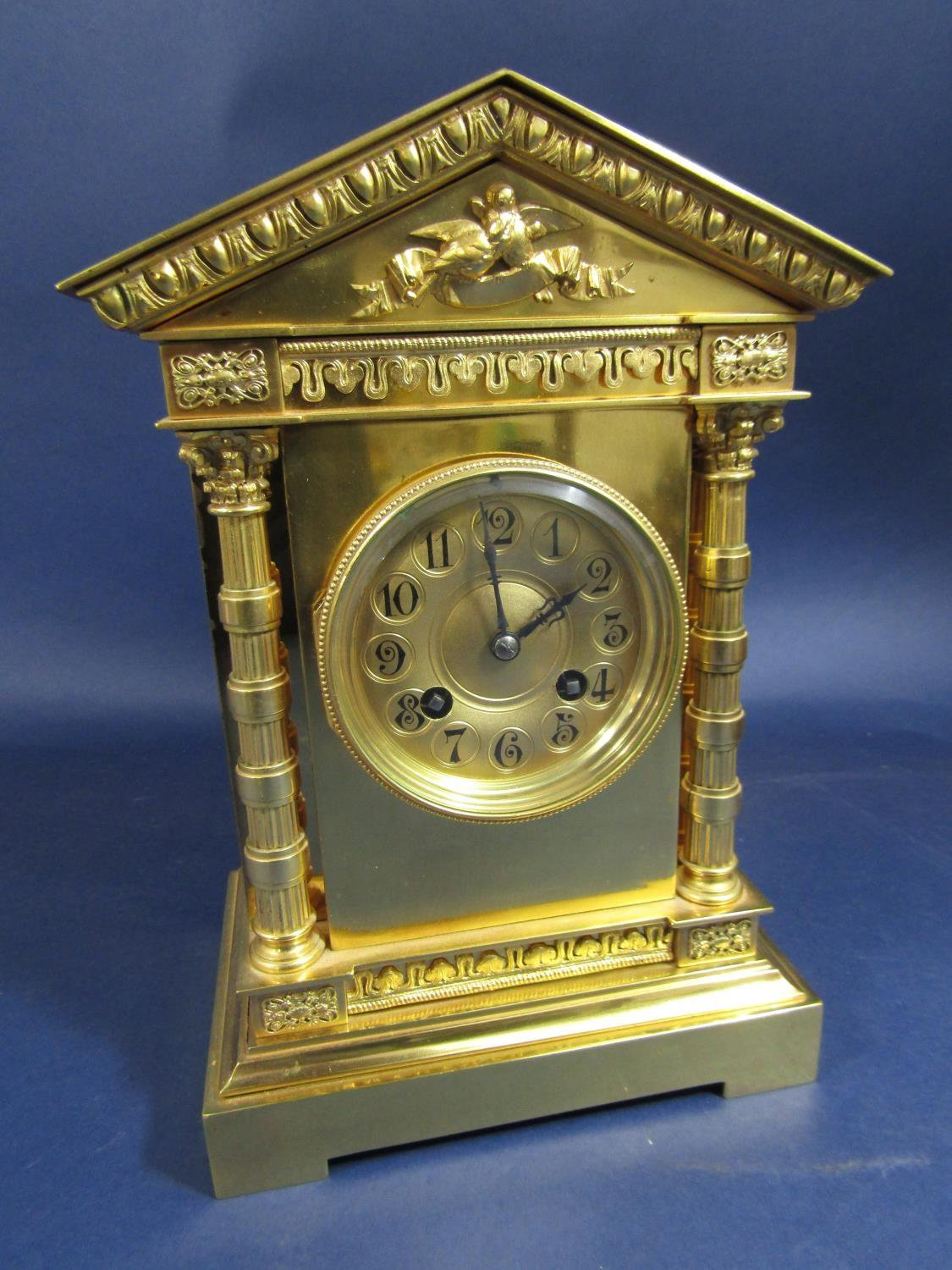 A good quality gilt brass architectural mantle clock, the gilt two train dial with Arabic