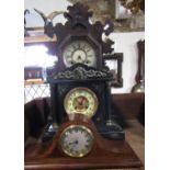 19th century black slate mantel clock of architectural form, the dial with enamel chapter ring and