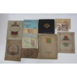A box containing a collection of various cigarette card albums produced by John Player & Sons,