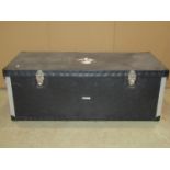 A fibre and aluminium re-enforced trunk containing a composite human skeleton, with applied label