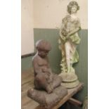 A weathered cast composition stone garden figure of a standing classical maiden holding a jug down