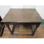 A countrymade oak cottage table, with plank top supported on four bobbin shaped supports 76cm wide