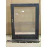 A vintage counter top shop display case with ebonised frame and door opening to reverse (AF), approx