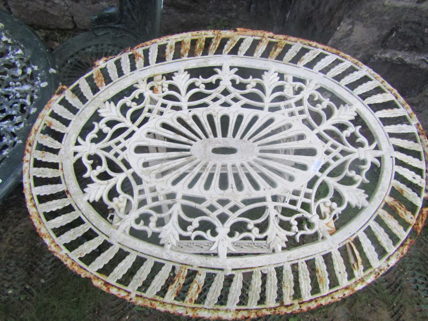 A cast aluminium garden terrace table of circular form with decorative pierced top and weathered - Image 2 of 3