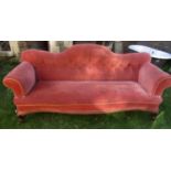 A substantial buttoned sofa with scrolled arms, shallow serpentine front and moulded mahogany
