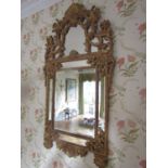 A large good quality contemporary reproduction gilt framed wall mirror with central bevelled edge