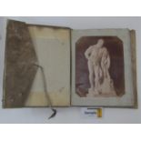 A vellum covered album containing a quantity of black and white pictures of Rome, Pompeii, various