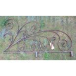 An ornamental iron work bracket with decorative scroll work detail, 120 cm x 70 cm approximately