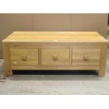 A low contemporary light oak coffee table of rectangular form fitted with six frieze drawers (3