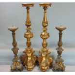 Large pair of carved giltwood pricket candlesticks, 80cm high, together with a shorter pair, 55cm