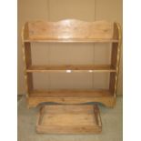 A stripped pine dwarf freestanding open bookcase, with fixed shelves and shaped outline, 98cm wide x
