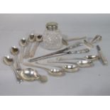 A mixed collection of silver spoons to include a stylised caddy spoon, pair of novelty golfing