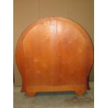 An art deco style walnut veneered display cabinet of circular and slightly waisted form with