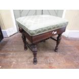 A Victorian rosewood piano stool of rectangular form, with upholstered seat and adjustable frame