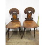 A pair of 19th century, mid European hall or side chairs, raised on four turned supports, with