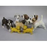 A collection of ceramic models of dogs including a pair of late 19th century yellow glazed models of