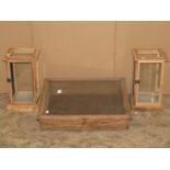 A shallow portable table top display case, with hinged sloping glazed panelled lid, together with