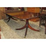 A good quality reproduction Georgian style mahogany twin pedestal dining table of rectangular form