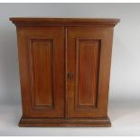 Edwardian fruitwood and boxwood inlaid table top cabinet, the two hinged doors enclosing a fitted