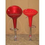 Two similar modernist adjustable moulded fibre glass and tubular steel high stools