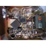 A box containing a collection of various silver plated items comprising flatware, teawares, napkin