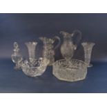 A collection of crystal cut glassware comprising two claret type jugs, a pair of flared vases, two