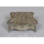Victorian provincial silver serpentine jewellery box, the hinged lid embossed with a romantic scene,