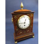 Regency style, brass inlaid flame mahogany mantel clock, with single train convex dial, with Roman