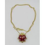 18ct novelty enamelled ladybird pendant / brooch, the diamond set hinged wings opening to reveal a