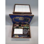 A good quality mahogany artists box, the hinged lid enclosing various watercolours by Winsor &
