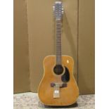 A Lorenzo Twelve string acoustic guitar model number 55/0 (requires restringing)